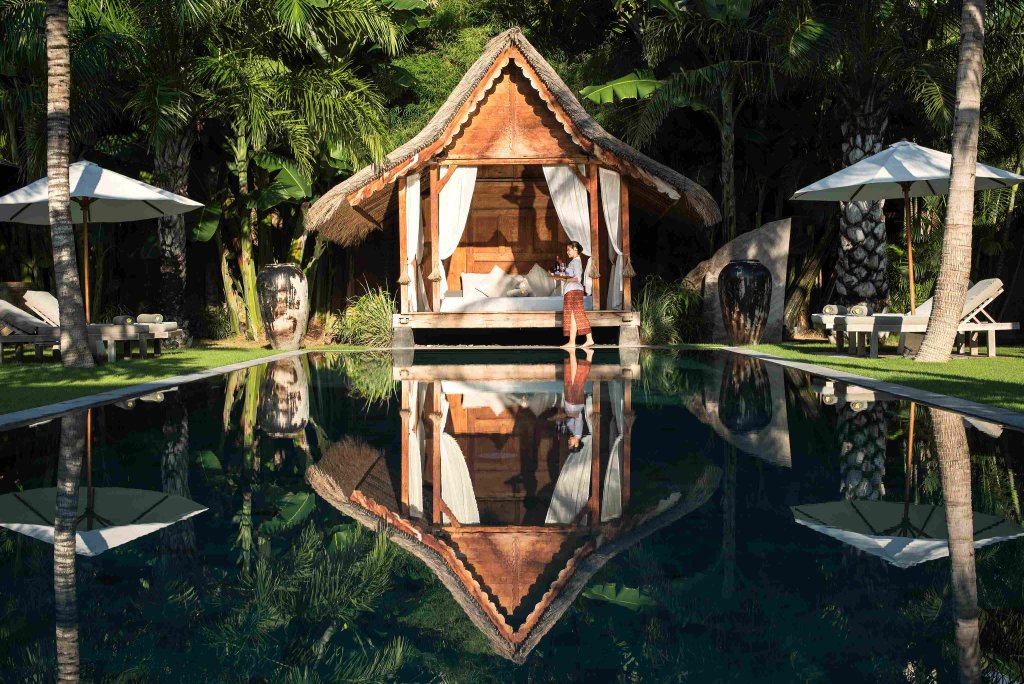 Villa Tiga Puluh, a modern tropical villa featuring a private pool, open-air living spaces, lush gardens, and Balinese-inspired architecture for a relaxing stay.