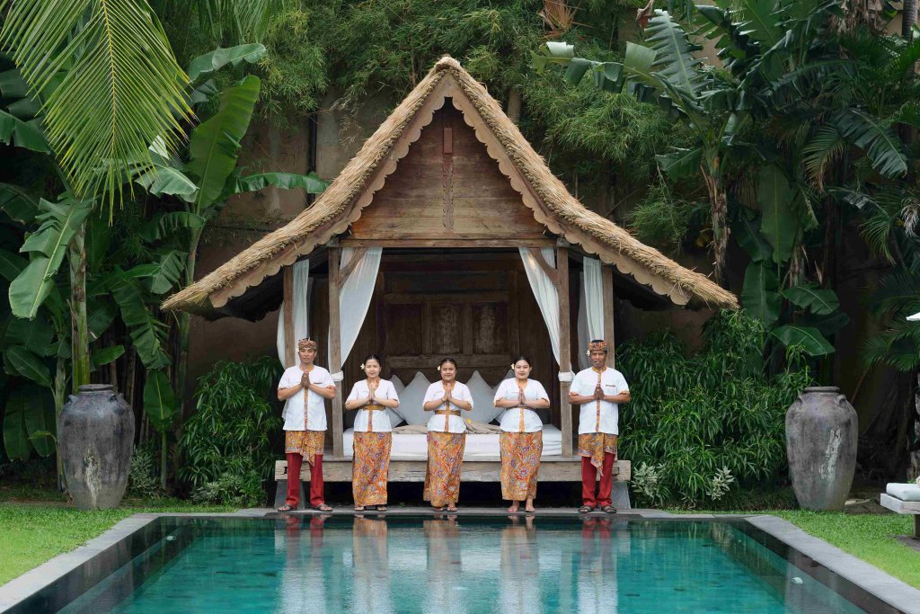 Villa Tiga Puluh, a modern tropical villa featuring a private pool, open-air living spaces, lush gardens, and Balinese-inspired architecture for a relaxing stay.