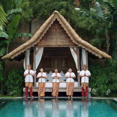 Villa Tiga Puluh, a modern tropical villa featuring a private pool, open-air living spaces, lush gardens, and Balinese-inspired architecture for a relaxing stay.