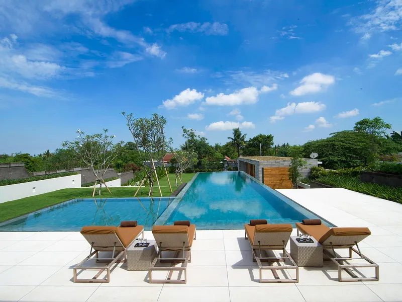 2. The Iman Villa – Sunloungers by the pool