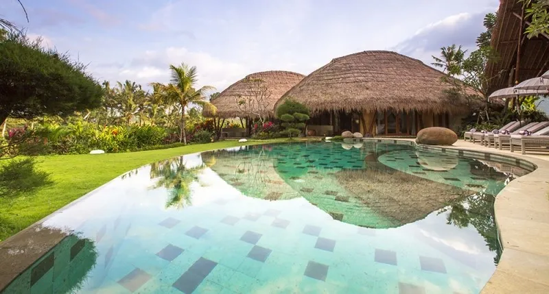 Open-plan living pavilion with tropical garden at Villa Omah Padi, Ubud